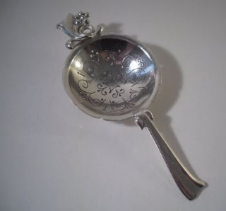 An Arts & Crafts Movement Sidney Sparrow Silver Tea Strainer : London 1953 photo