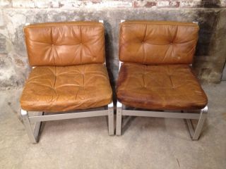 Very Rare Pair Of Karl Ekselius Leather And Aluminum Lounge Chairs photo