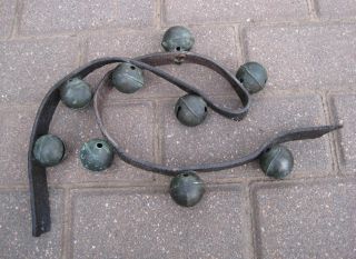 Vintage Antique Primitive Brass Christmas Sleigh Bells,  9 On Old Leather Strap photo