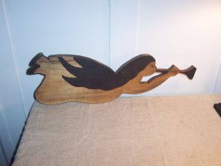 Folk Art Primitive Wooden Angel With Horn. photo