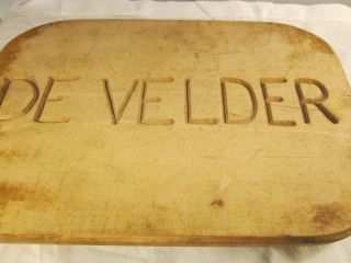 Vintage Cutting Board On Feet/says De Velder Carved In The Wood.  Neat. photo