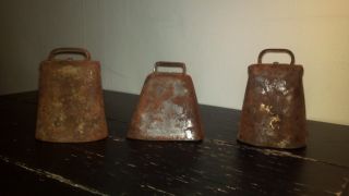 Three Antique Cowbells With Hand Wrought Rivets And Cast Iron Hinge photo