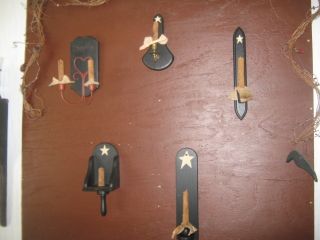 Primitive Variety Of Wooden Wall Sconces W/ Grubby Candles Have A Peek photo