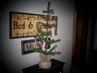 Tall Primitive Christmas Tree W/red & White Stockings photo