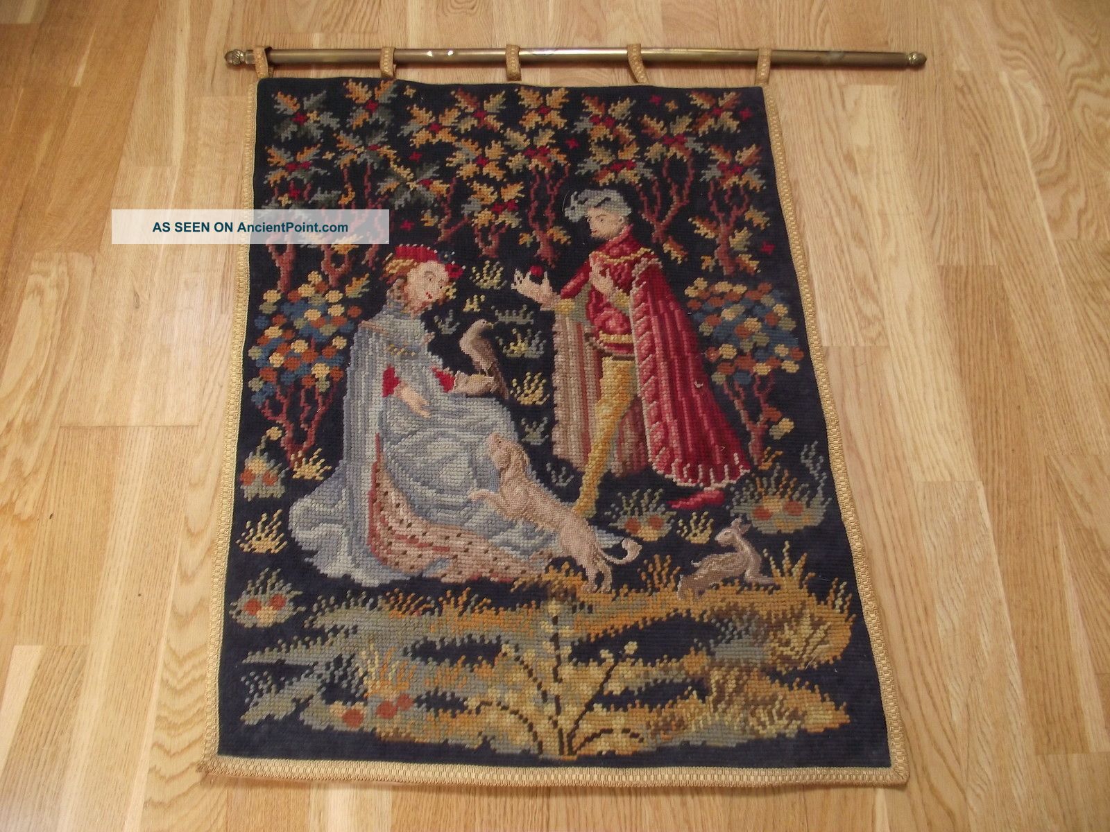 Old Colourful Tapestry On Brass Decorative Hanging Bar Tapestries photo