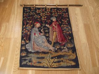 Old Colourful Tapestry On Brass Decorative Hanging Bar photo