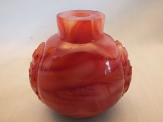 A Good Chinese Red Glass Snuff Bottle With Well Carved Motifs On The Sides19thc photo