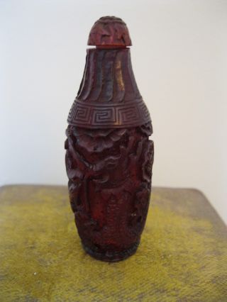 Wonderfully Carved Chinese Cherry Amber Dragon & Pheonix Snuff Bottle photo