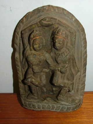 Stone Carving Of 2 Dancing Figures photo