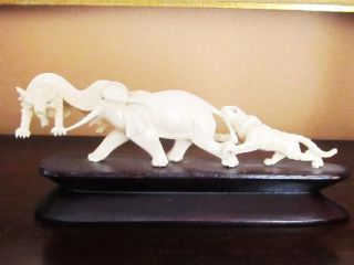 Ox Bone Elephant And Fighting Tiger Statuette Figurine photo