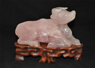 Chinese Carved Pink Crystal With Boy Riding On The Unicorn photo