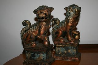 A Pair Of Cast Iron Foo Dogs.  Guardian Lions. photo