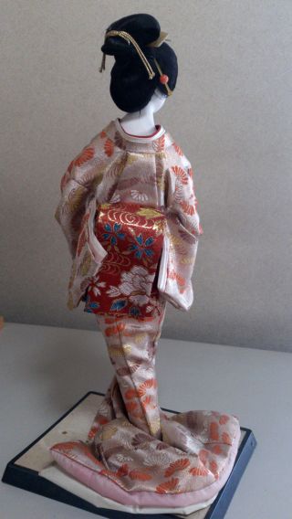 A Japanese Geisha Kimono Doll Dancing photo