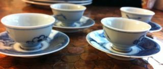 An Antique Set Of Four Cups And Saucers photo