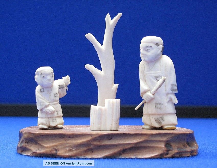 Antique Japanese Carved Ox Bone Father & Son Netsuke Okimono On Wood Stand Statues photo