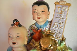 Hand Painted Chineses Figurene 2 Children And A Dragon. photo