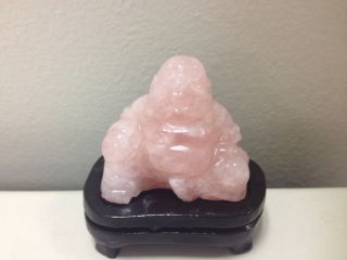 Hand Carved Rose Quartz Happy Buddha With Wooden Stand photo