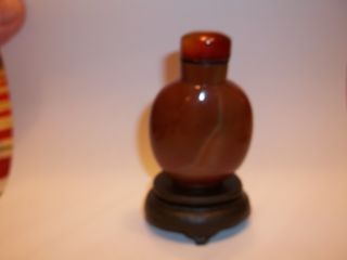 Carved Snuff Bottle - Burnt Orange Agate W/ Carnelian Agate Top And Wood Stand photo