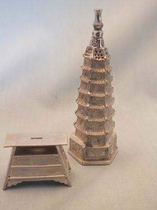 A Chinese Silver Pepper Pot In The Form Of A Pagoda & A Chest Of Drawers 20thc photo