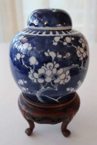 20th Century Chinese Decorated Porcelain Jar With Lid And Teak Wood Base photo