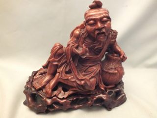 Chinese Carved Hardwood Figure Of Old Recumbent Man On Its Darker Stand 19thc photo