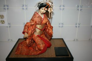 Vintage Kneeling Japanese Geisha Doll By Nishi On Bamboo Platform 50 - 60 ' S photo