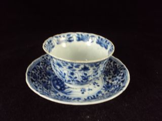 A Chinese Porcelain Cup And Saucer,  Kangxi Period,  Flowers photo
