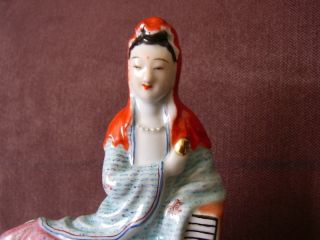 Chinese Porcelain Famille Rose Kwan Yin Seated On Rock photo