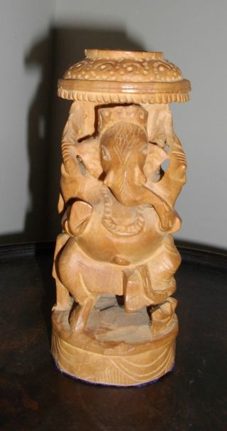 A Carved Wooden Indian Deity Figure photo