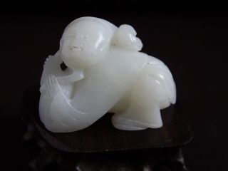 Chinese White Jade Carving Boy With Hat photo