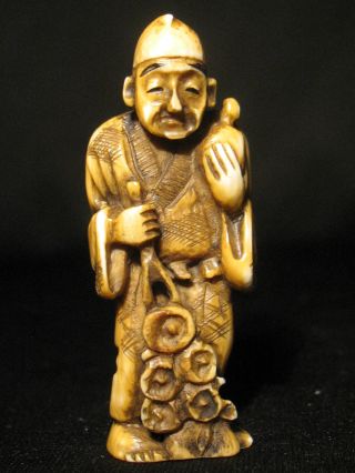 Antique Japanese 象牙 Stained Inked Ox Bone Netsuke Immortal? Man W Flowers Signed photo