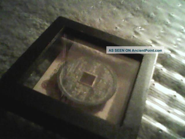 A Large And Antique Asian Coin With A Signature Stamp In Red. Other photo