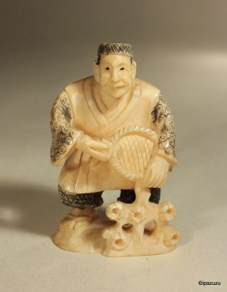 Japanese Carved Netsuke Smiling Man photo