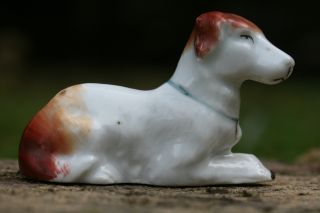 19th C.  Staffordshire Miniature Porcelaneous Recumbent Dog photo