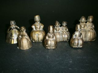 A Group Seven Victorian Style Brass Dutch Children Table Bells photo