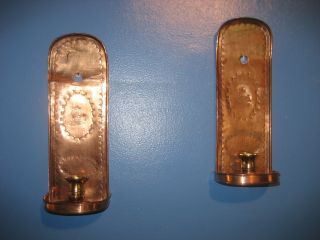 A Pair Of Copper Wall Candle Holders With Art Deco Of A Ship photo