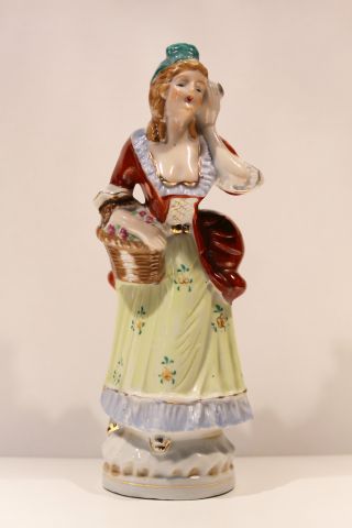 Vintage Porcelain Lady With Flower Basket,  Holding Flower To Ear photo
