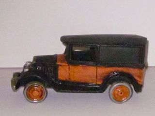 Iron Metal Antique Studebaker Car Toy In Orange And Black photo