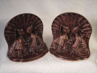 Antique Late 19th C.  Solid Copper Bookends / Oriental Couple W/ Fan Background photo