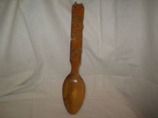 Skilled Craftsman Carved Wooden Spoon. photo