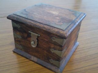 Antique Wooden Box With Brass Decorations photo