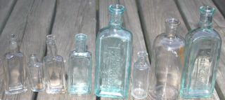 8 Antique Vintage Old Clear Green Blue Glass Cork Top Embossed Bottles photo