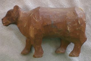 A Rough And Crude Cow/bear Carving photo