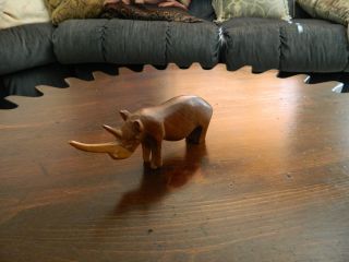 Solid Had Carved Wooden Rhino Figurine photo