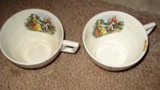 Antique Tea Cups With Painting On Inside Of Victorian Man And Woman photo