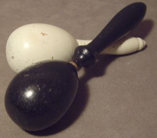 Two Vintage Hand Crafted Painted Hard Wood Darning Eggs - One Black & One White photo