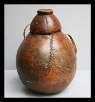 An Ethiopian Container With Lid,  Made Of Wood With Leather Stitched Cover photo