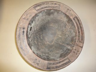 African Tribe Bowl With Symbols For Washing? Wont Set Flat photo