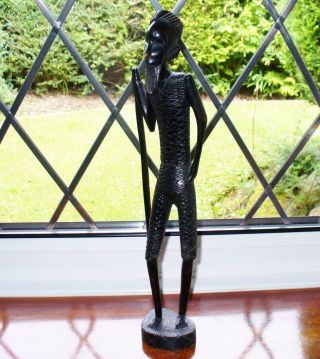 Vintage African Carving - Wooden Statuette Of An African Tribesman photo