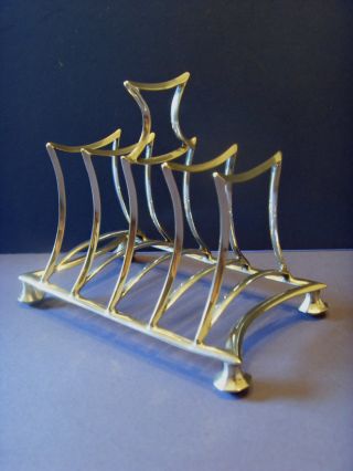 Early Vintage Silver Plated [e.  P.  N.  S] Four Piece Toast Rack. photo